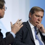 Siemens President and CEO Eric Spiegel listens to a question from IHS CERA Vice President Lawrence Makovich during the CERAWEEK world petrochemical conference in Houston