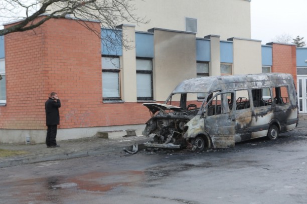 The battle for bodies in Lithuania has grown violent. Here, a hearse that was blown up.