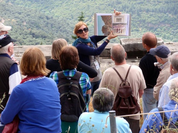 Petra Tsaousidou, a traditionally-trained tourist guide, speaking to tourists in Delphi.