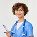 smiling-female-doctor-9CYG24X.jpg